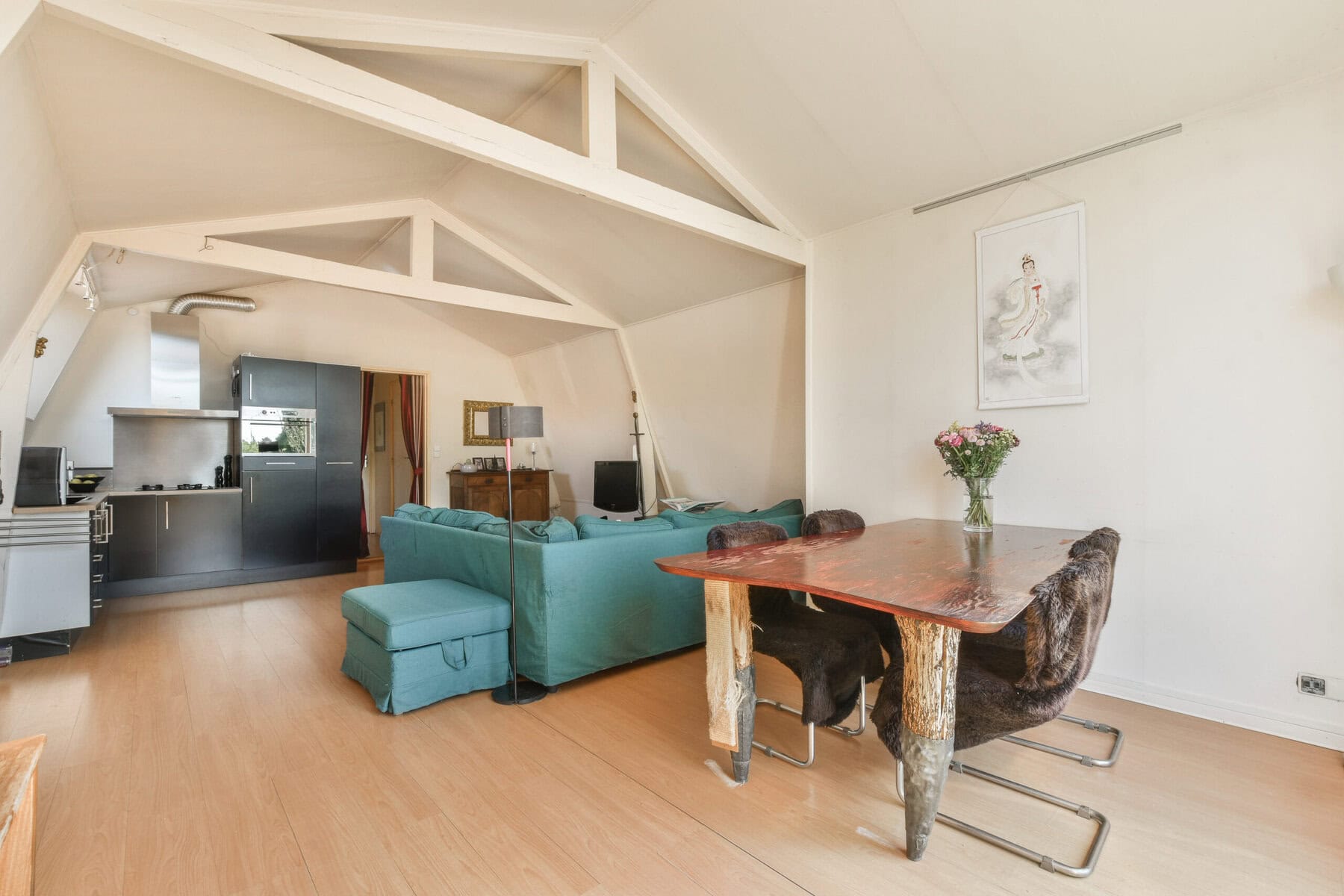 Modern living room with open kitchen and stylish furniture in Amsterdam.